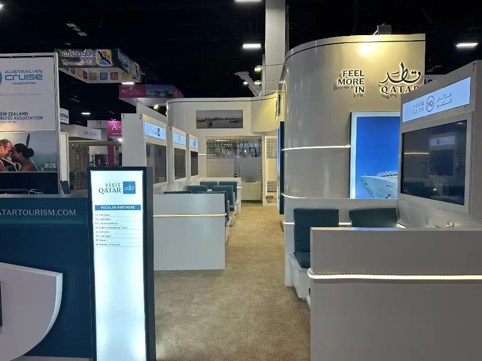 Counter with kiosk display beside teal lounge seating