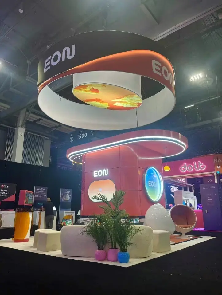 Ring canopy with a sky graphic hanging above the orange pod