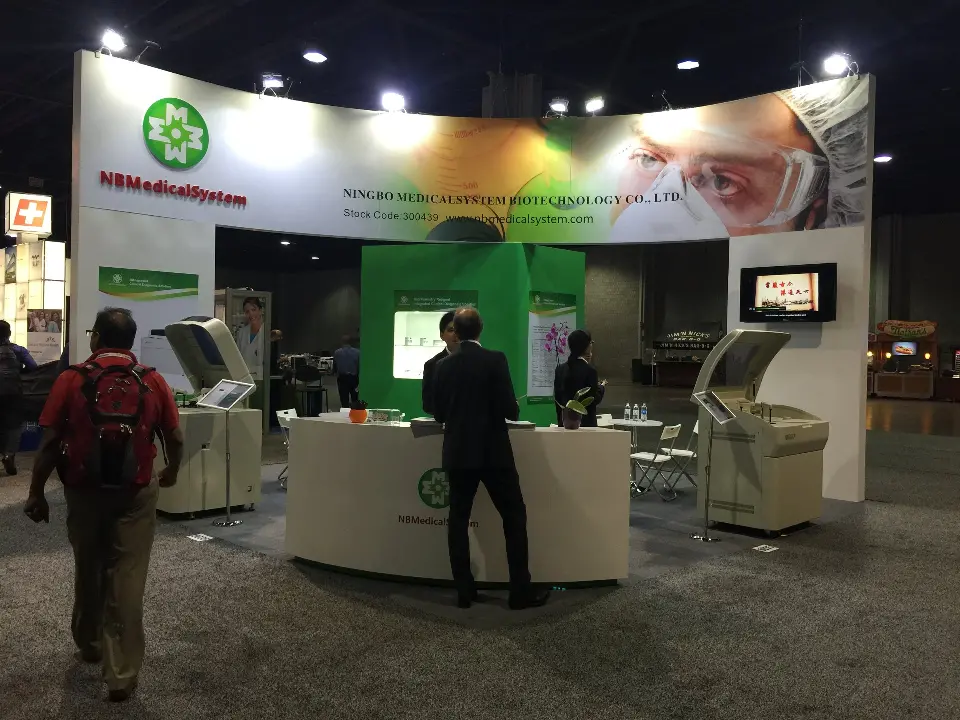 Finished booth front with round white logo counter and curved face graphic header