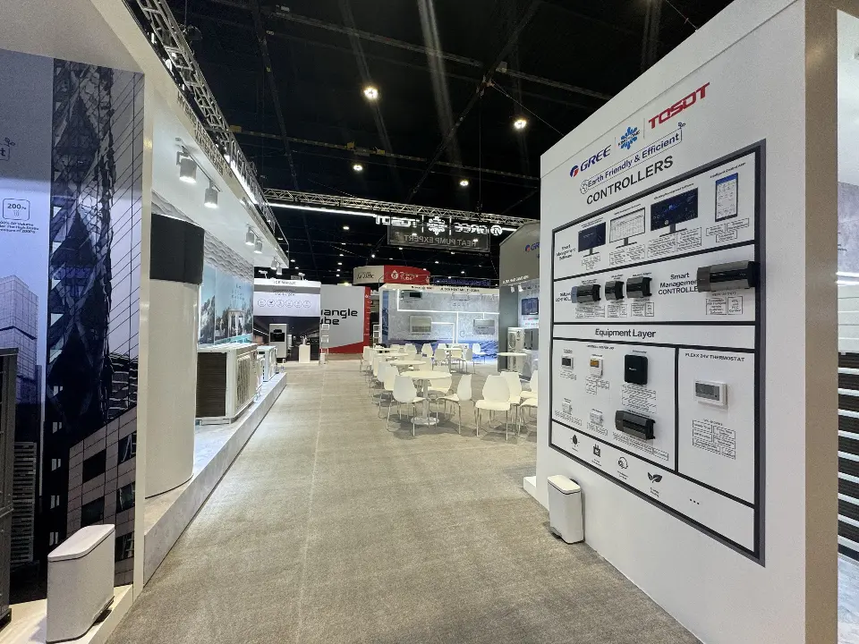 Long aisle view of the thermostat and controller wall beside the meeting area