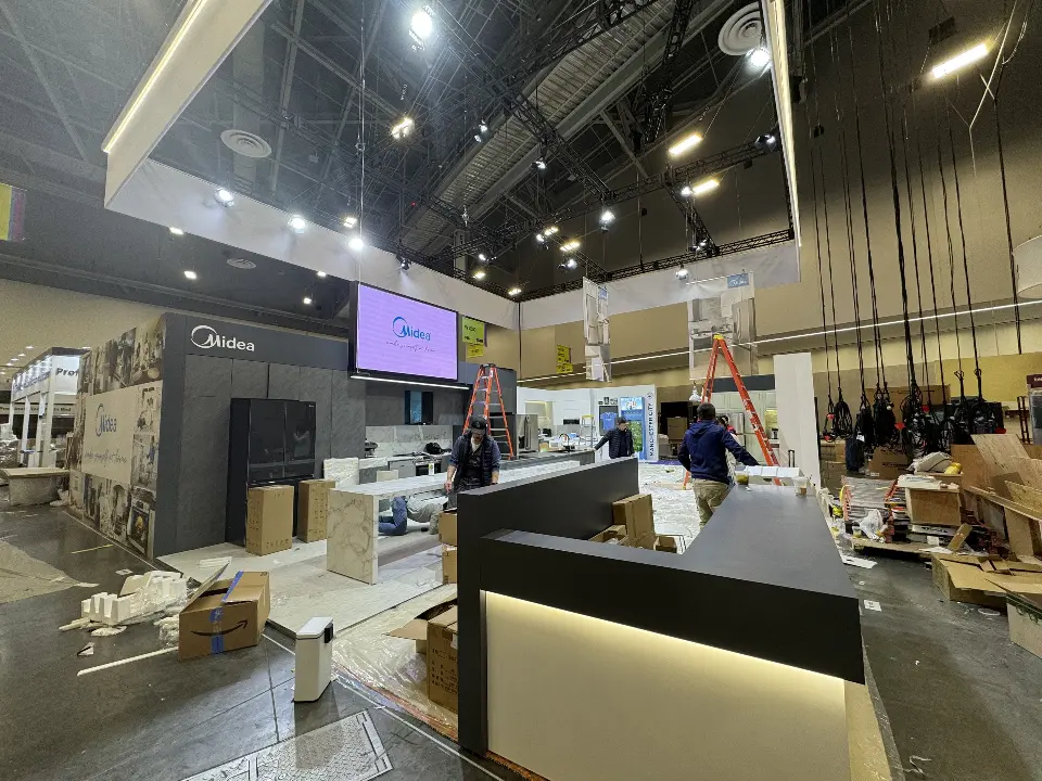 During installation: purple-lit screen on a grey wall behind the dark counter