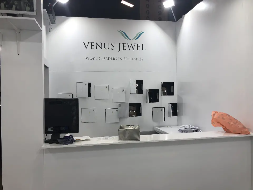 White meeting room counter with a monitor and framed images on the wall