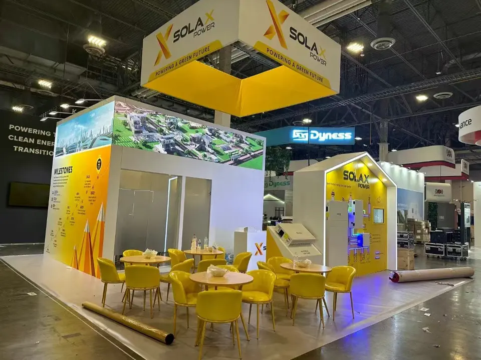 Rear view with yellow chairs, tables and a solar photo header above a white room