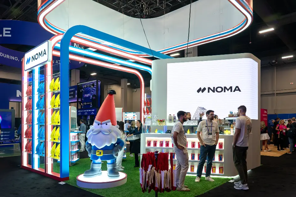 Gnome statue, lit arches and NOMA logo screen behind the merchandise counter