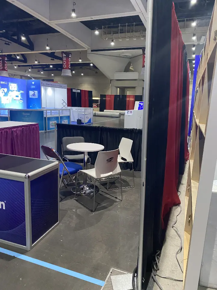 Meeting room corner with display furniture seen through an opening