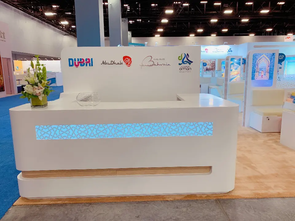 Reception counter with Dubai, Abu Dhabi, Bahrain and Oman logos