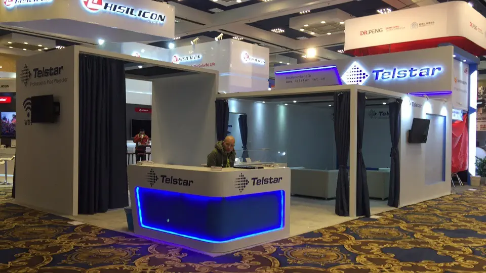Telstar booth at CES 2017 with curtained demo rooms and a blue-lit white reception counter