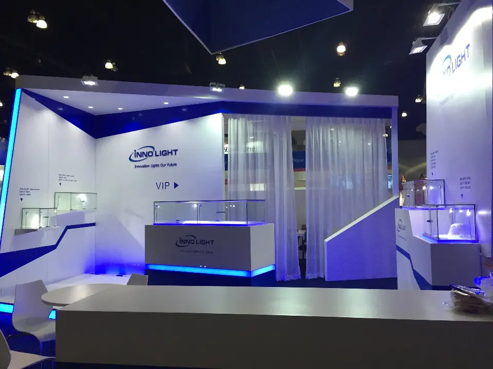 White display cases and curtained room with a blue lit base