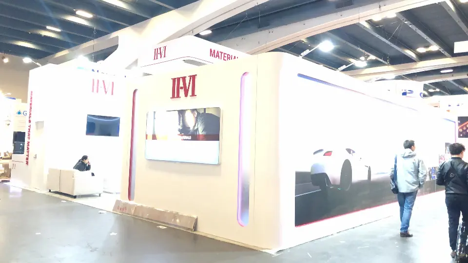 Long outer wall with panoramic car graphic and backlit II-VI logo strip