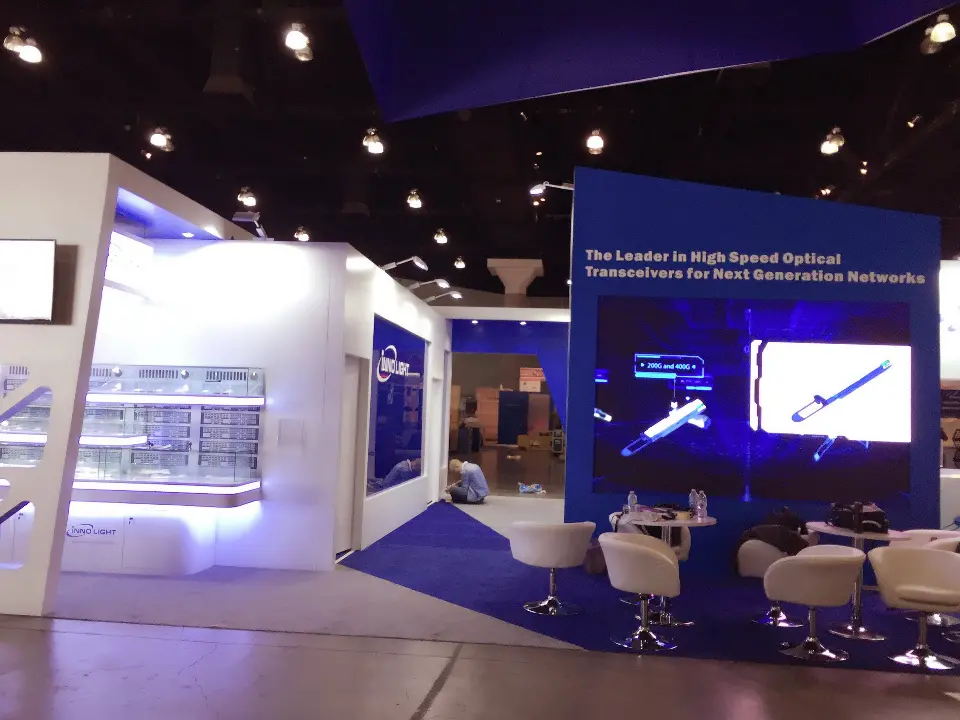 Interior view of the lit showcases and blue wall graphic