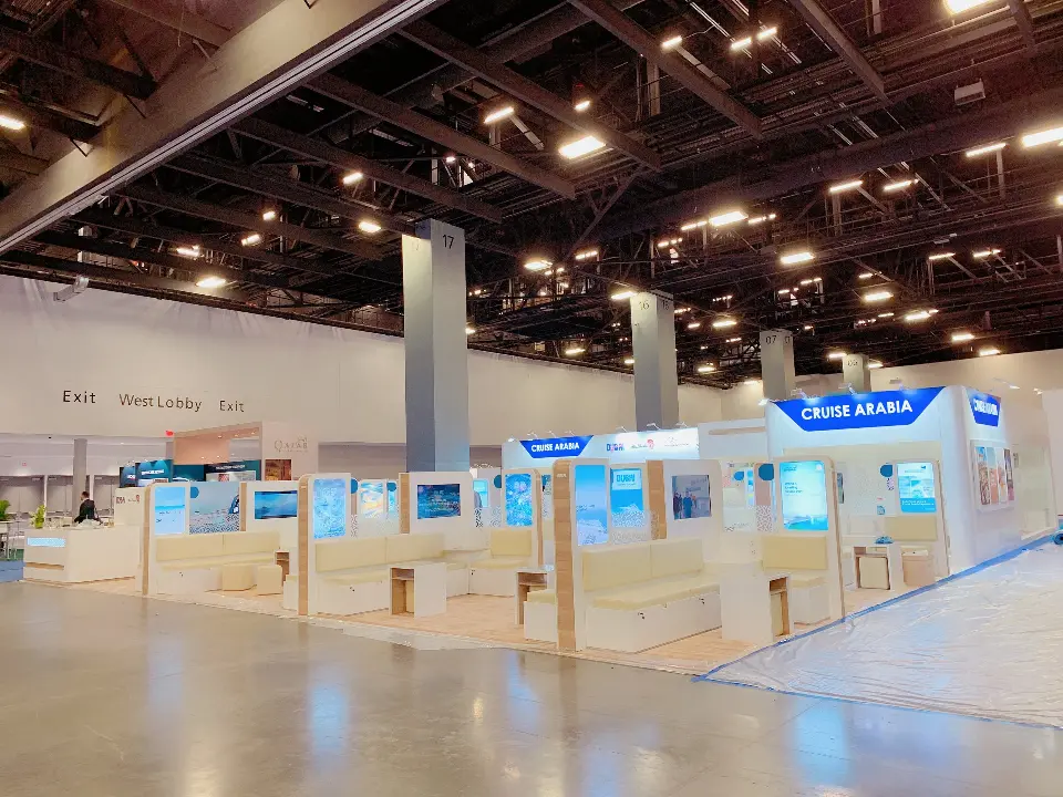 Long side view across the booth showing rows of backlit columns