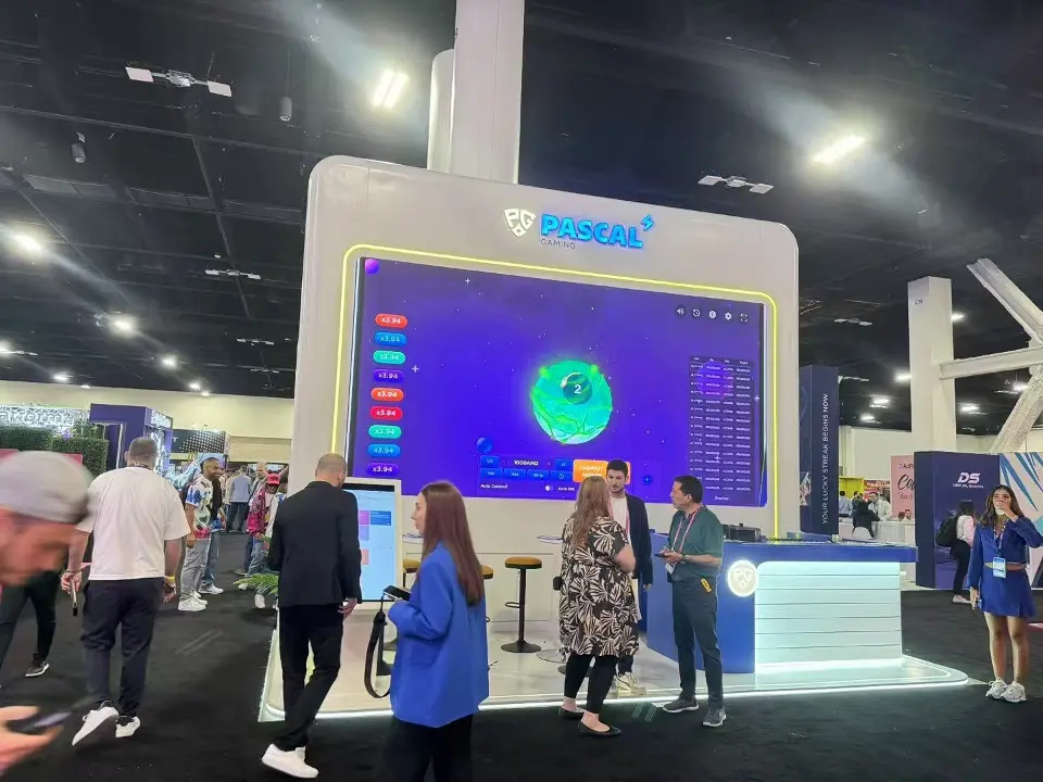 Large screen showing a dashboard above a white counter lit along its base