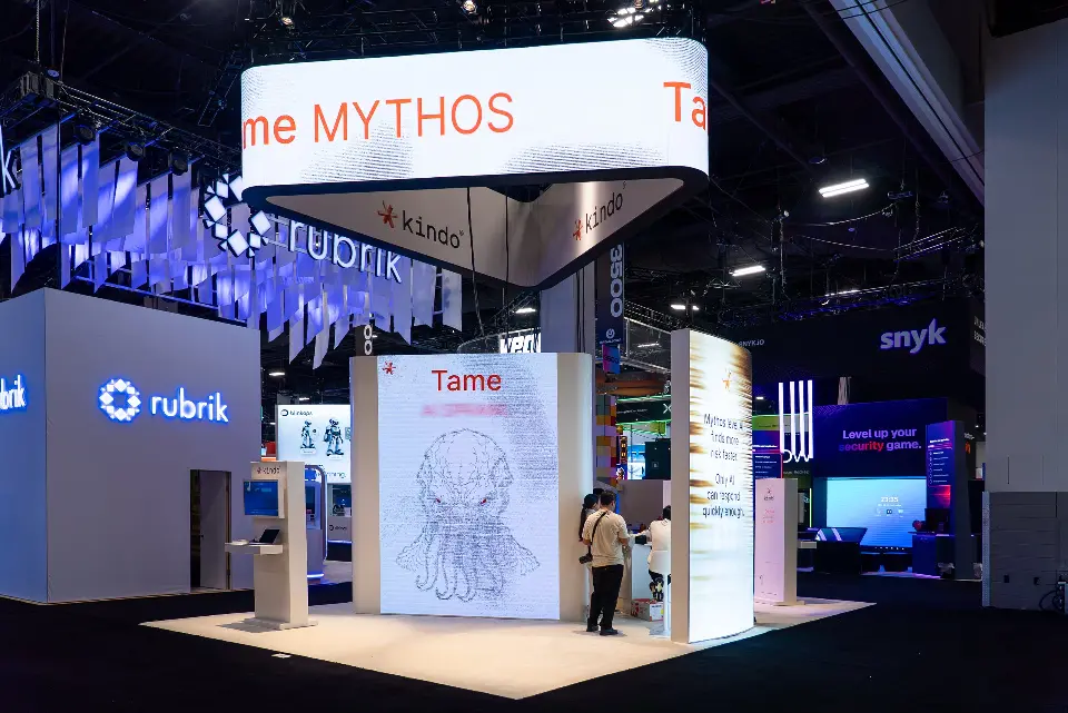 Oval Tame MYTHOS hanging header above backlit white towers with an octopus drawing