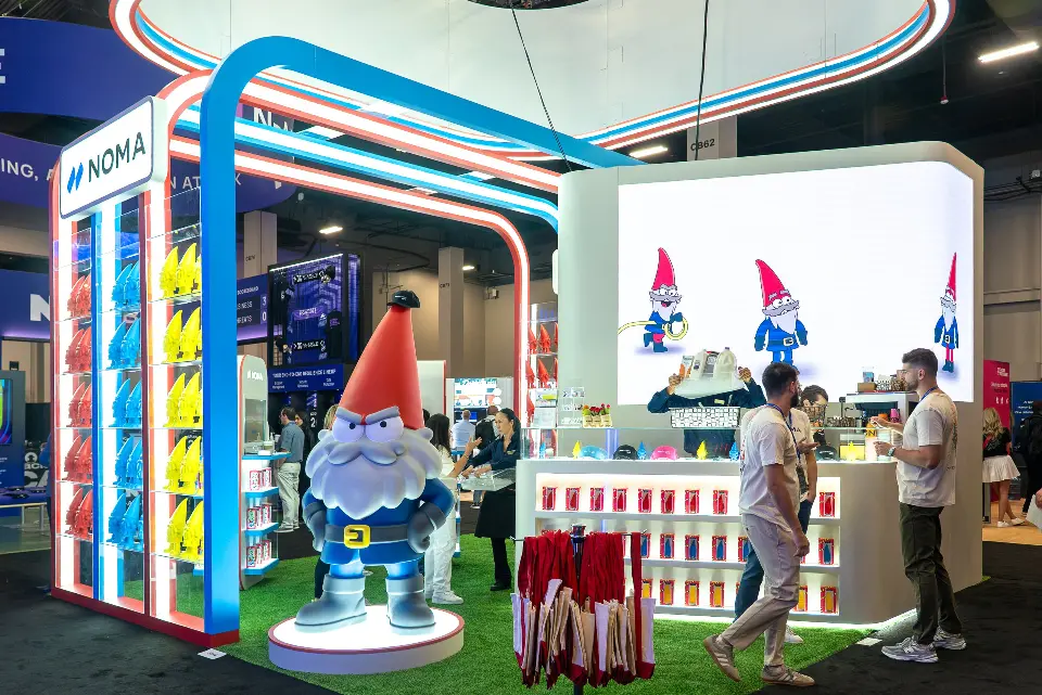 Visitors at the backlit merchandise counter with gnome statue in front
