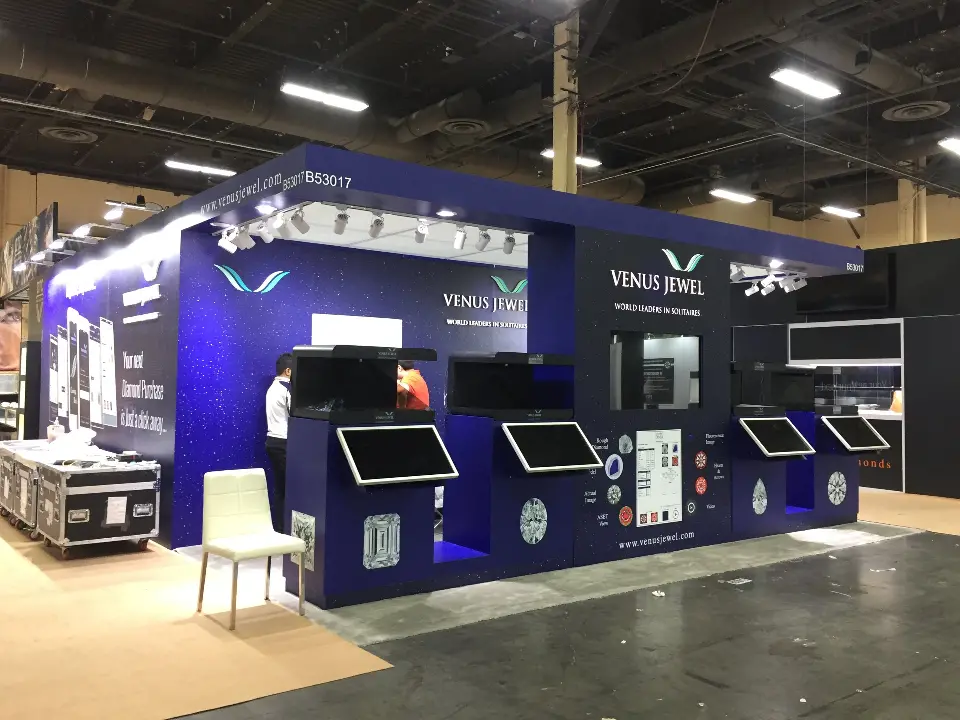 Wide view of the Venus Jewel booth showing kiosks along two sides
