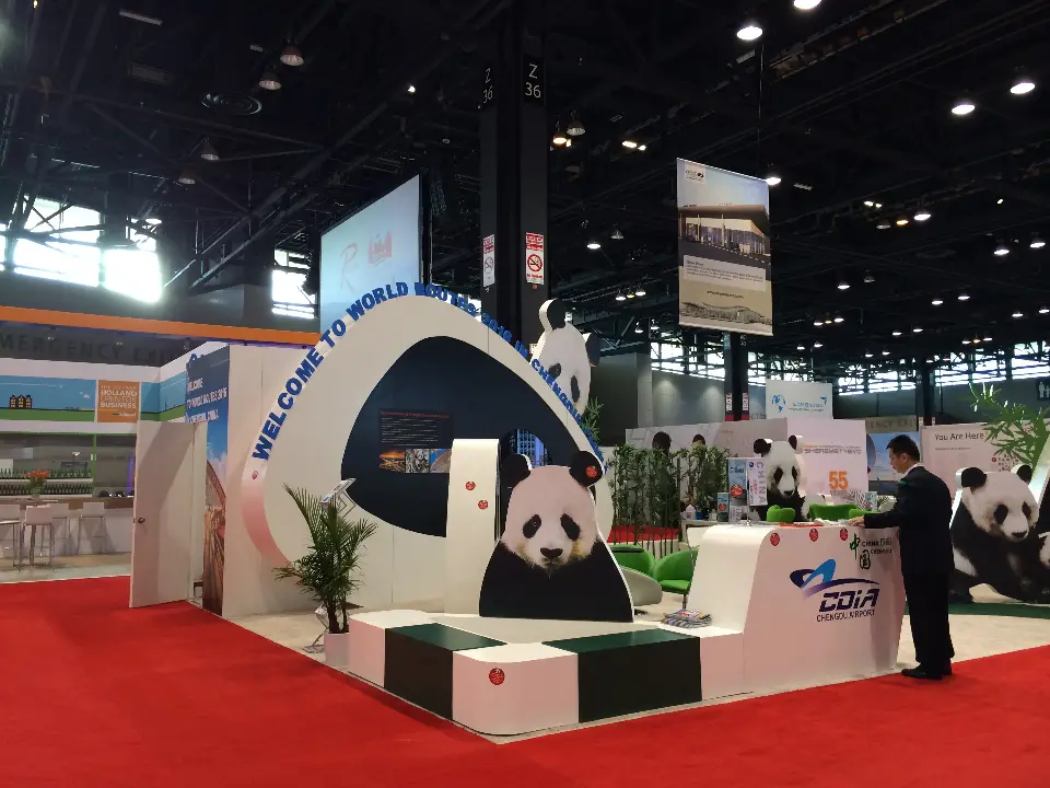 Chengdu Airport stand at World Routes 2014 with white panda arch, panda cut-outs and curved CDIA bench