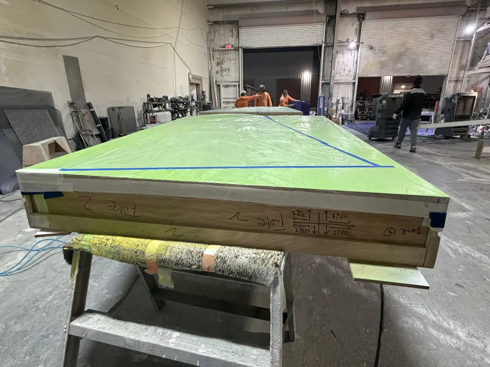 During build-up: green and navy ring section being finished in the workshop