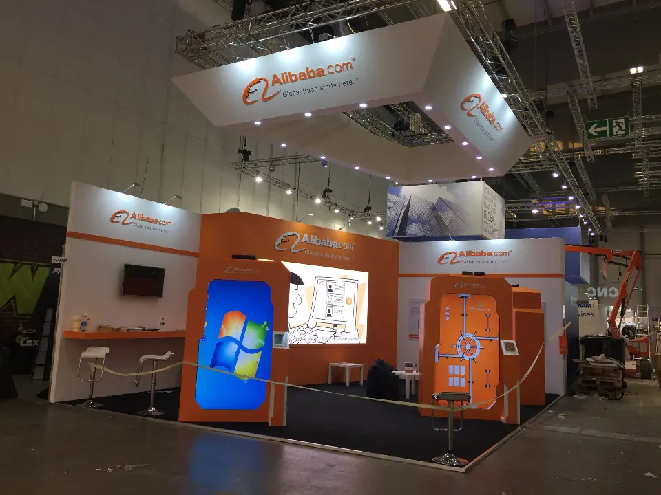 Booth view with a bright animated graphic on the large backlit screen