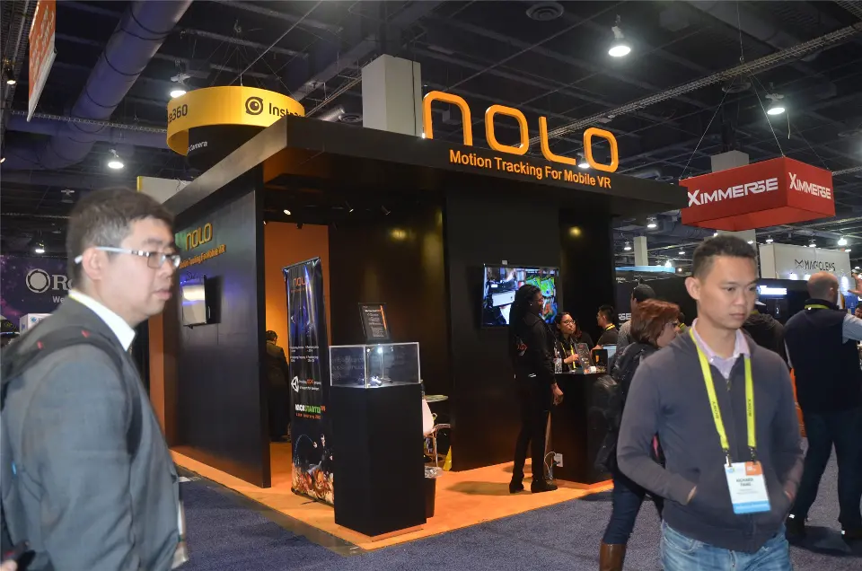 NOLO booth corner with overhanging black roof, wall monitor and Motion Tracking For Mobile VR fascia