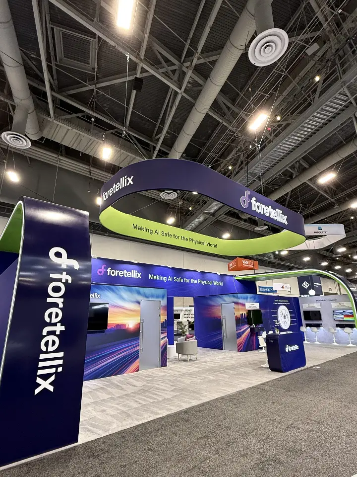 Logo column at left with the booth stretching into the distance