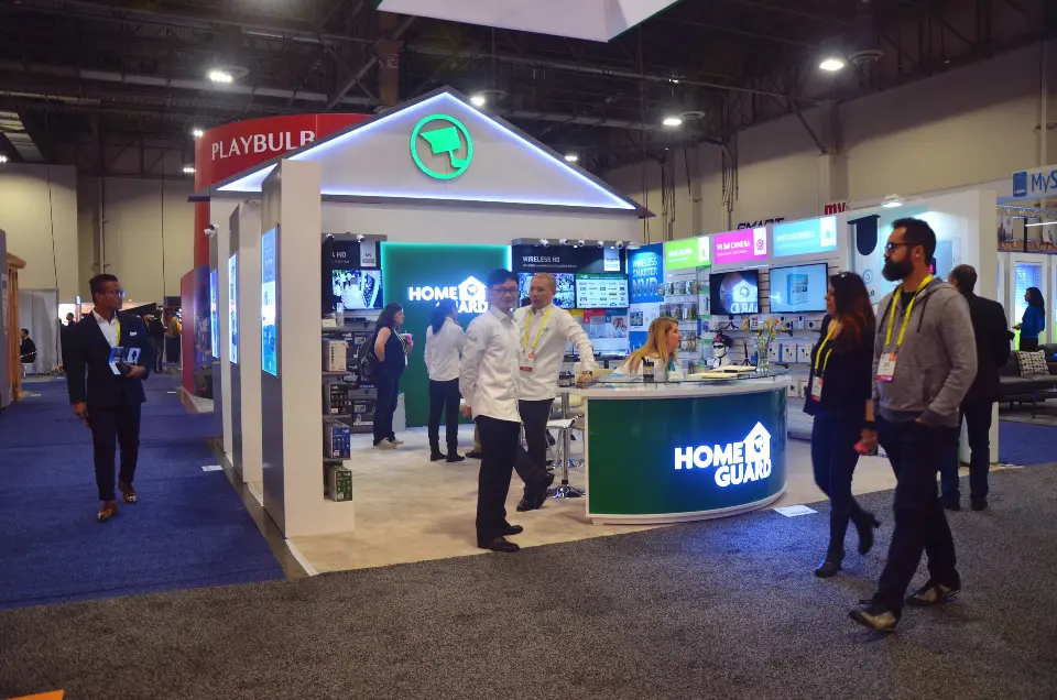 Finished house-shaped booth with a green counter and visitors