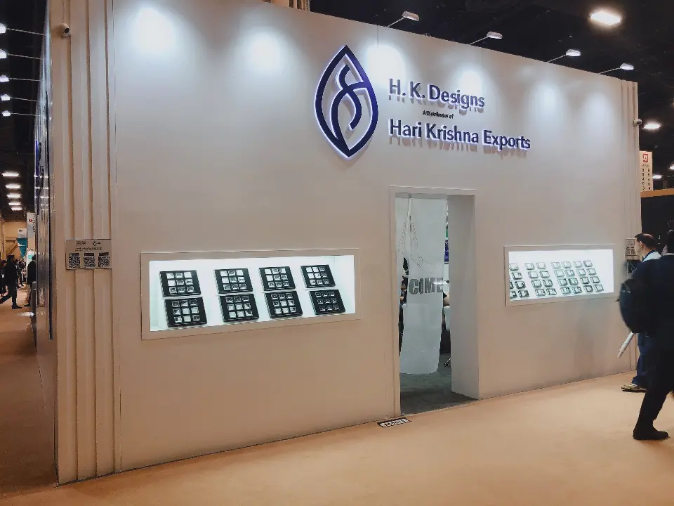 Frontal view of the white wall, logo, entry door and illuminated product windows