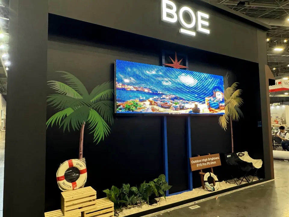 Close view of the beach scene with life rings, crates and sand below the screen