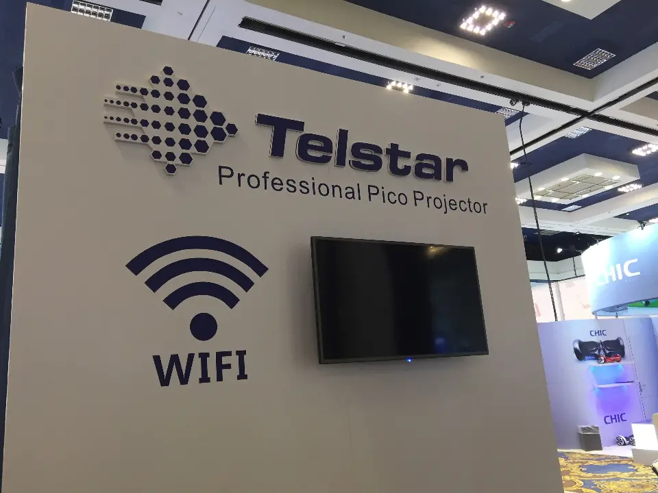 Close-up of the Telstar Professional Pico Projector wall with WIFI graphic and mounted screen
