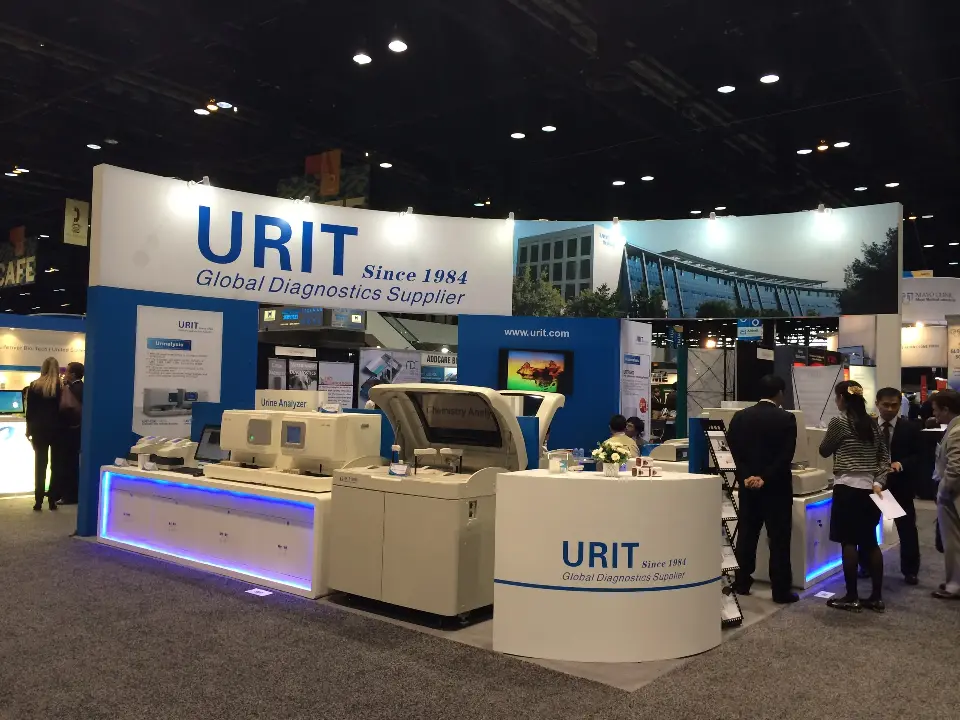 Front corner with curved URIT fascia, analyzers on counters and a curved logo desk