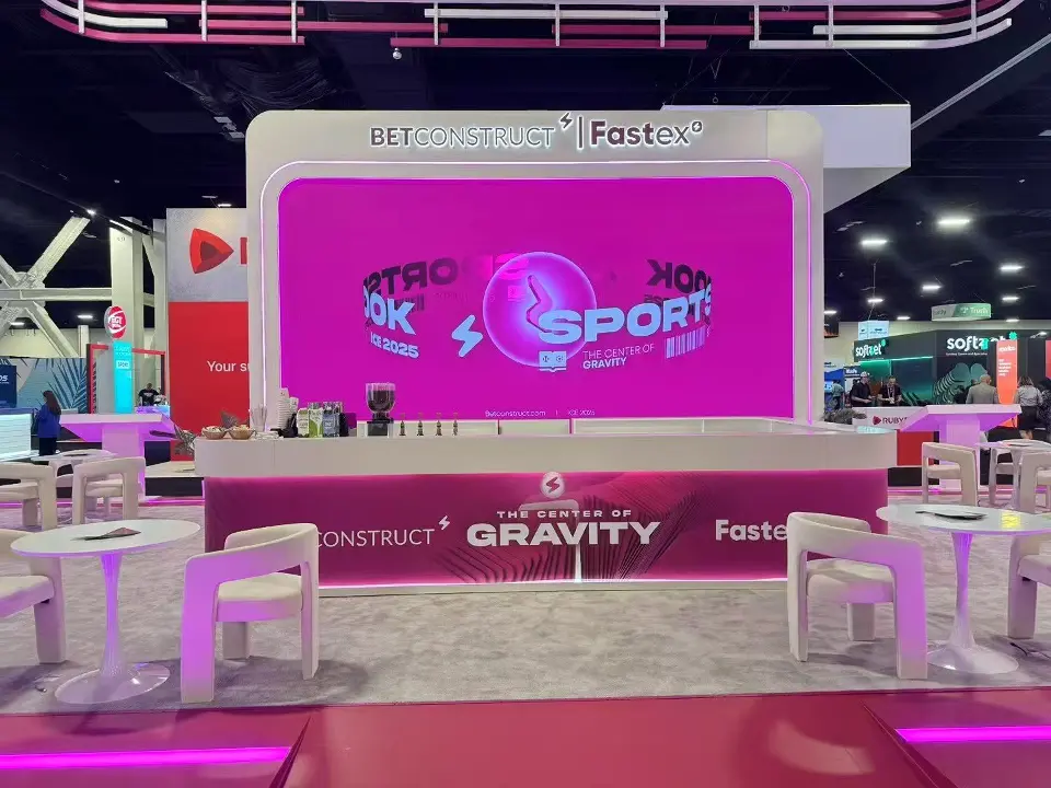 Front of the stand with GRAVITY counter and large pink screen behind