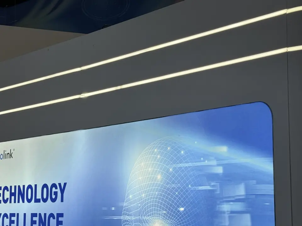 Detail of white light lines running above a backlit technology graphic