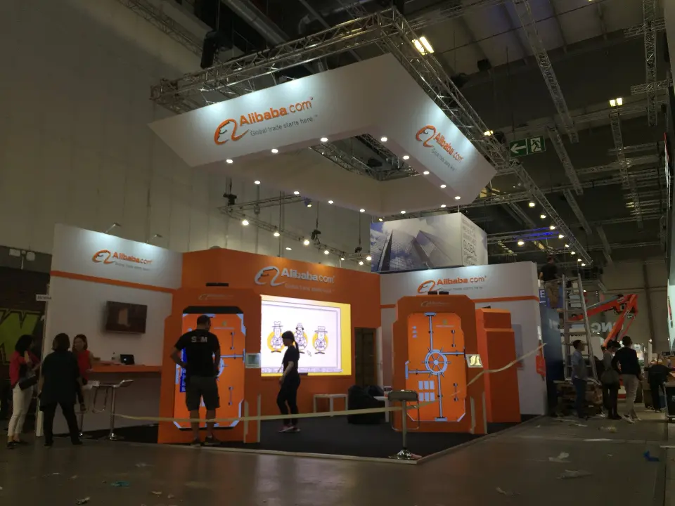 Rope barrier around the booth with screens lit inside the orange frames