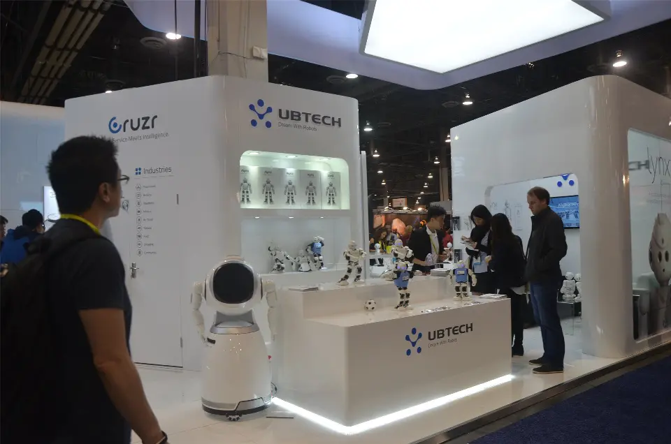 Lit UBTECH counter with robots, service robot and backlit product shelves