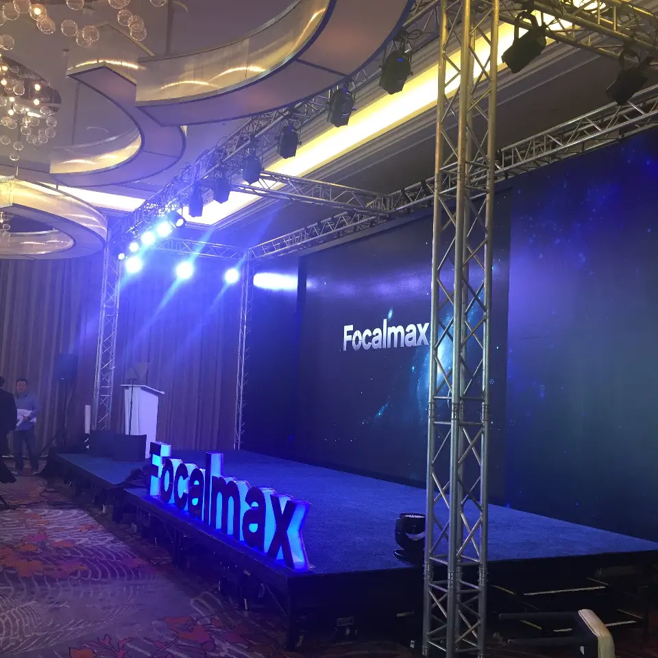 Focalmax stage with blue lighting and lettering on the stage front