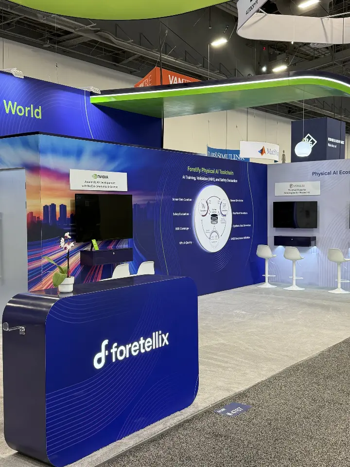 Navy counter beside a wall screen and circular product graphic