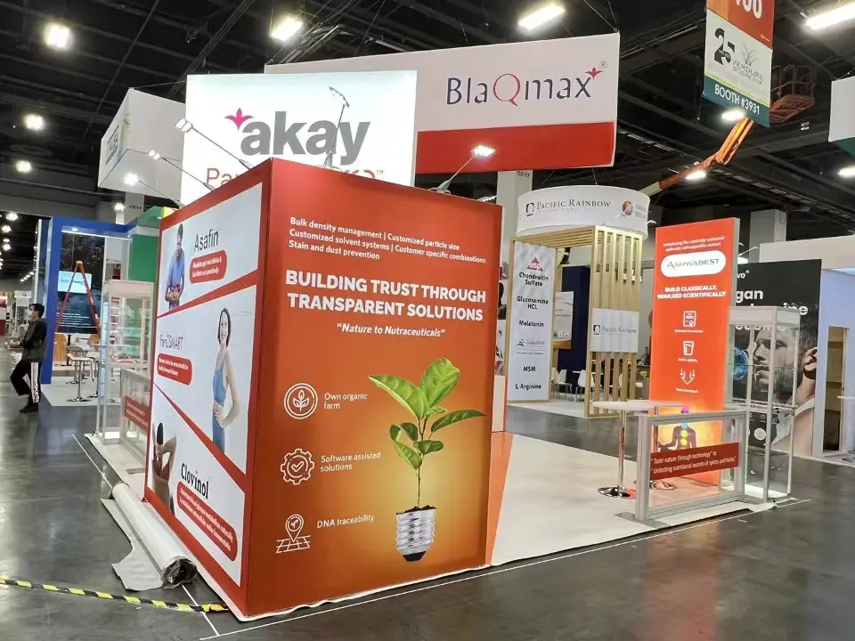 Backlit Building Trust Through Transparent Solutions wall with plant graphic