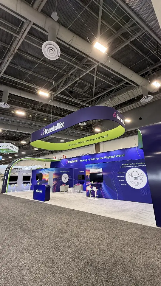 Narrow low-angle view down the aisle toward the navy booth