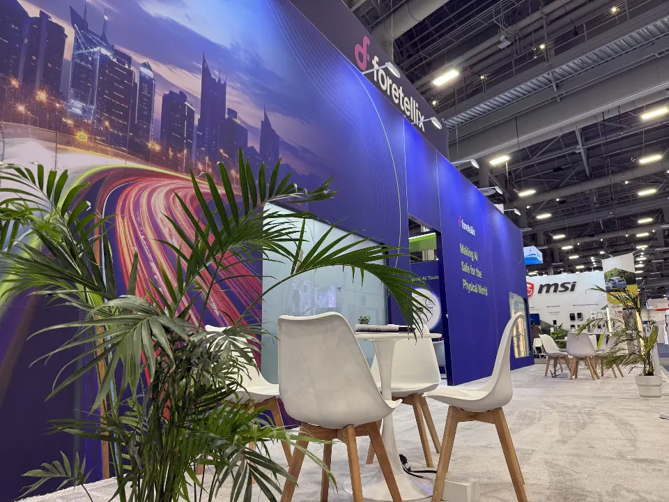 Second angle of the palm, cafe chairs and city mural wall