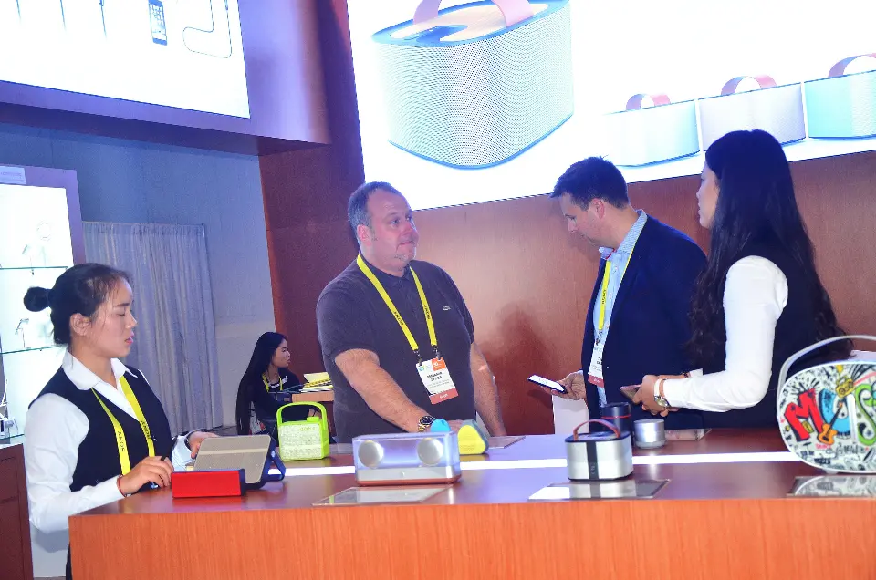 Staff and guests around products on the counter under the lightbox