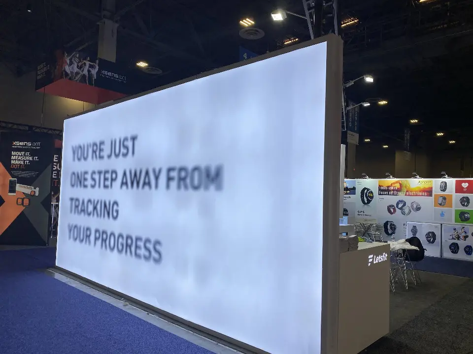 Close view of the backlit graphic wall facing the aisle