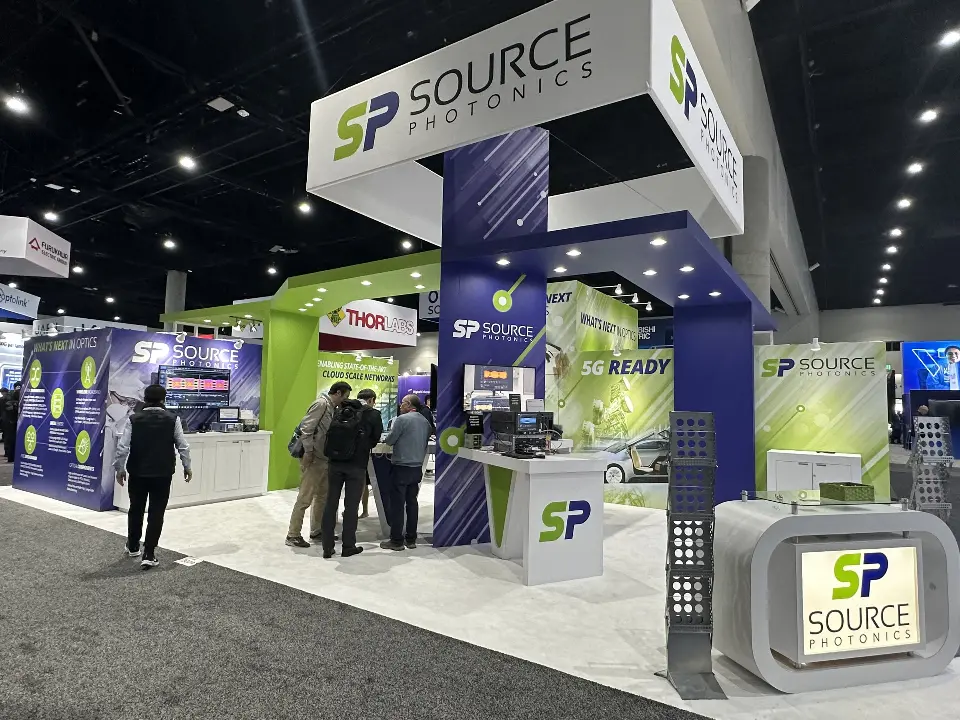 Wider frontal view with the lit SP logo counter and brochure rack