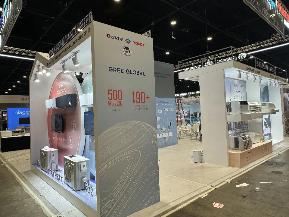 GREE Global tower with heat pump unit display inside a lit white frame