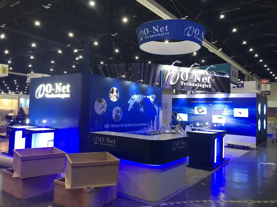 During build-up: O-Net counters, blue ring sign and lit graphic wall with crates