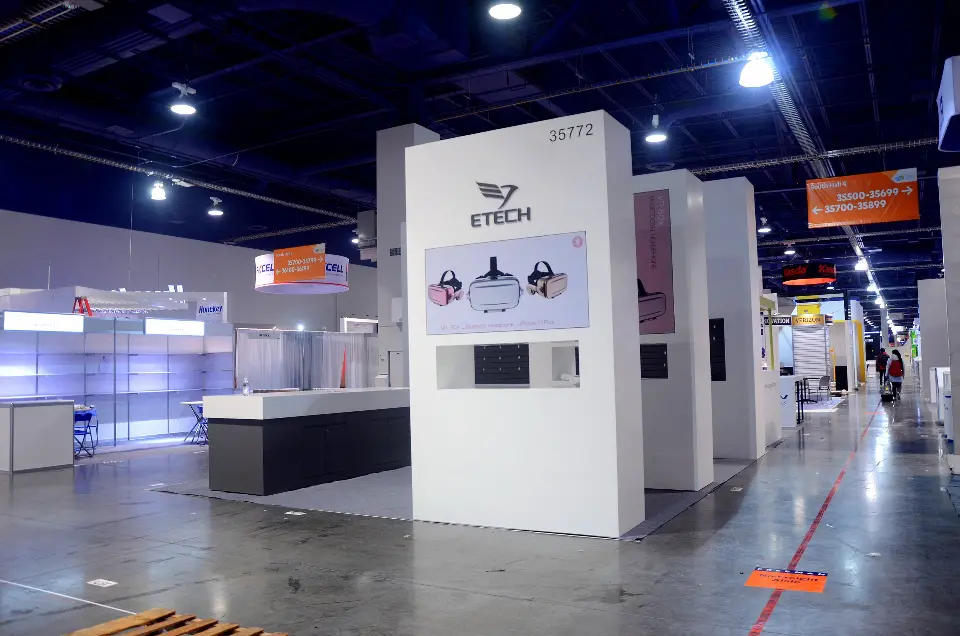 Side angle of the ETECH tower with backlit product graphic and white back wall