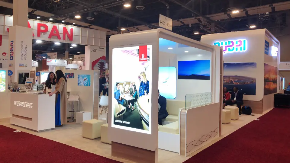 Tall backlit lightbox with a travel image beside the counter