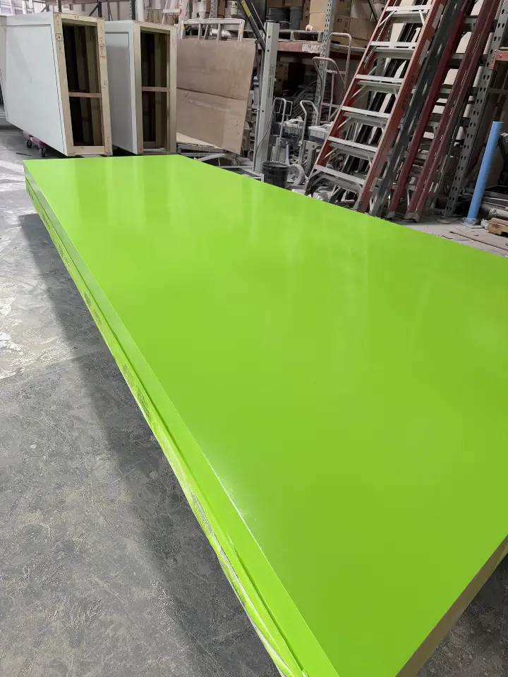 During build-up: a lime-green ring panel laid out in the workshop