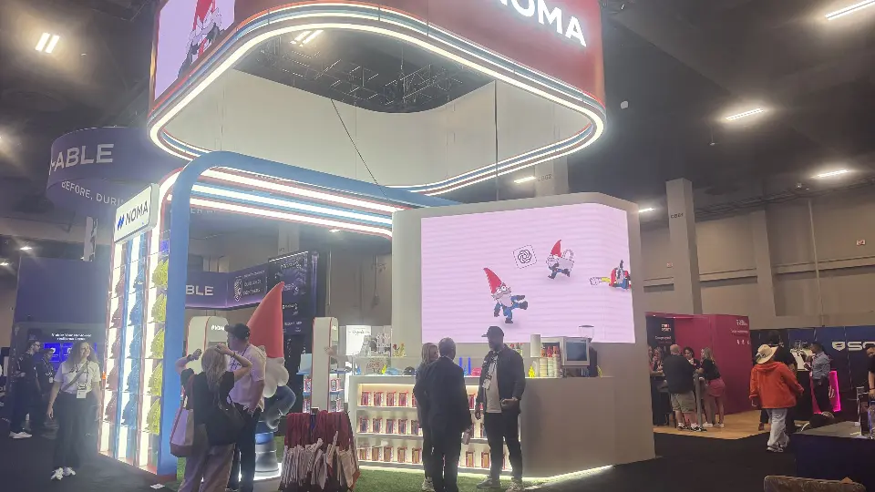 Crowd at the counter under the overhead ring with gnome animation on screen