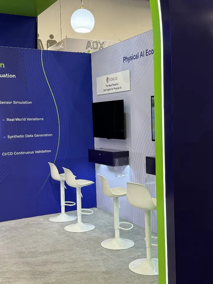 Side demo counter with white stools under a green-edged arch