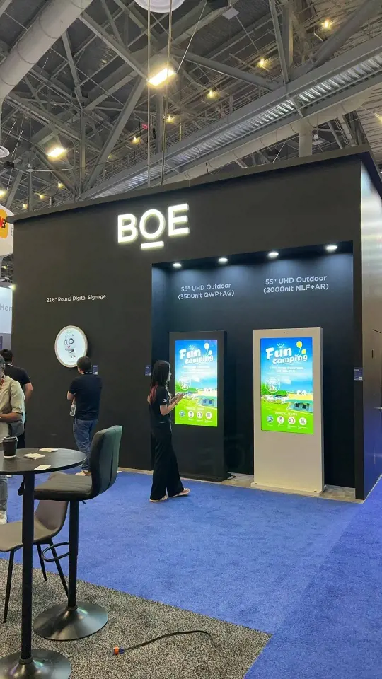 Portrait view of a black tower with tall kiosk display screens
