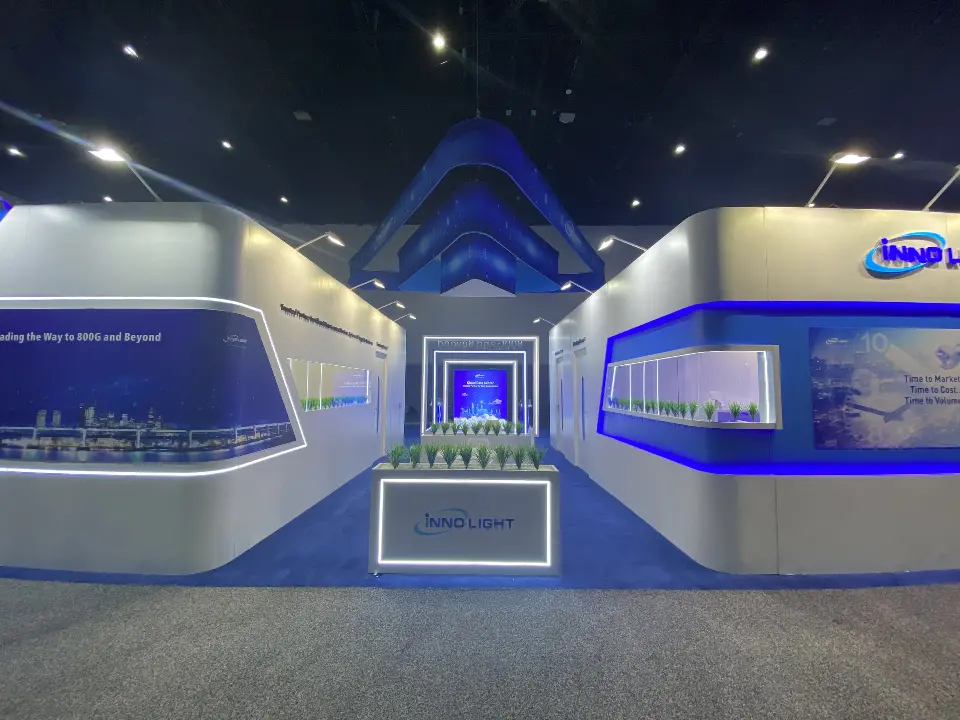 Straight-on view of curved counters, lit portal and blue triangular canopy